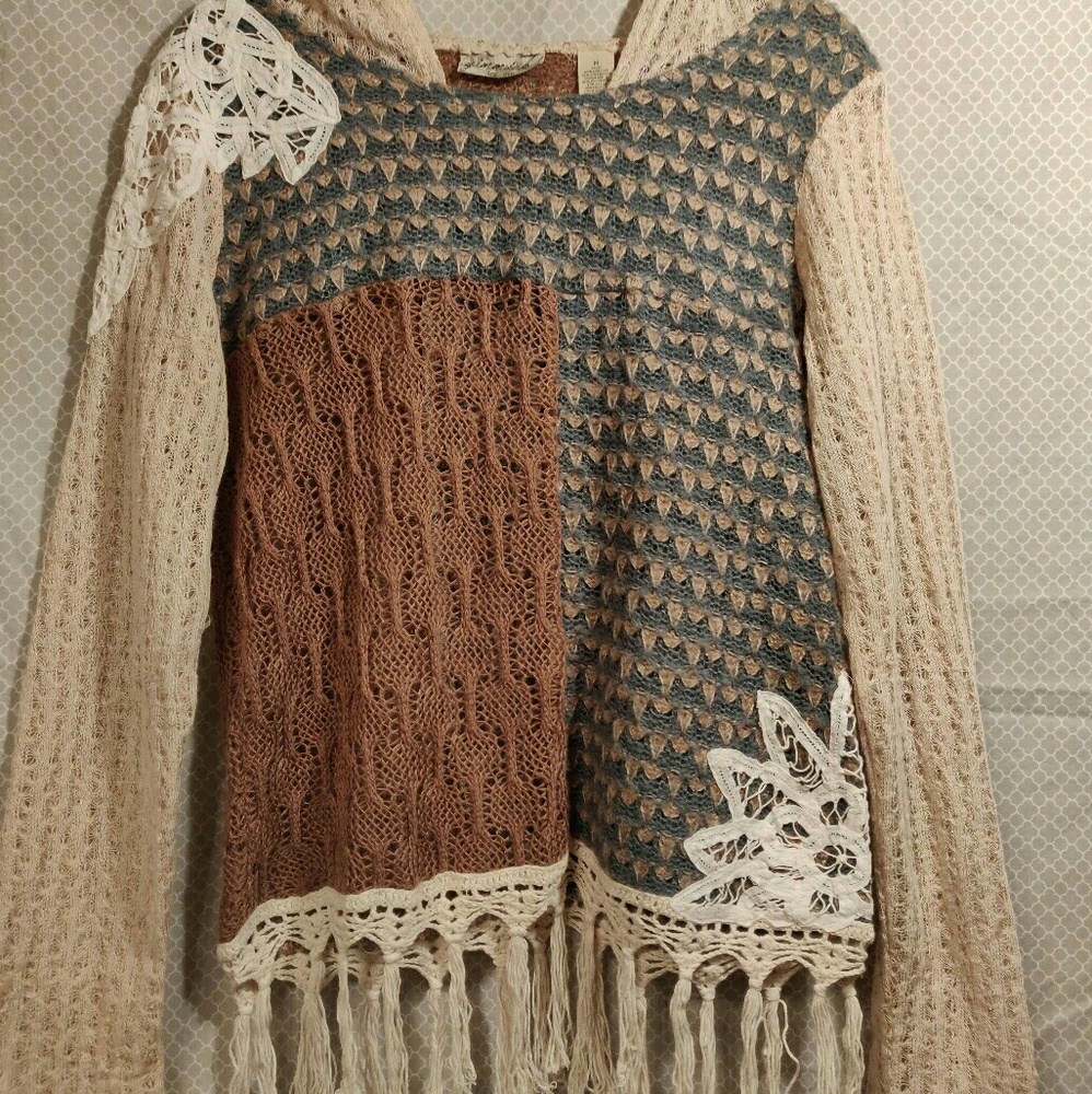 Buckle brand applique tassled sweater